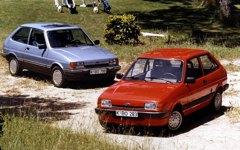 Red and a blue 1983 Ford Fiesta
